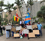 Foreign nationals gathered outside Durban's City Hall on Saturday to protest against violence in Zimbabwe 
