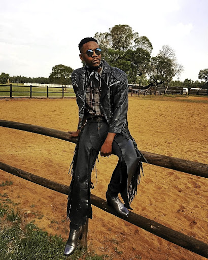 Designer Sihle Masango pairs a tasselled jacket with leather chaps and a plaid shirt.