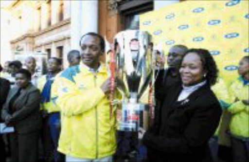 THE PARADE: Mamaledi Sundowns boss Patrice Motsepe, left, with Tshwane Mayor Dr Gwen Ramokgopa during the side's victory parade throught the streets of Pretoria yesterday. Pic. Kopano Tlape.