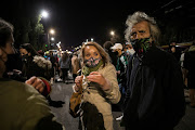 People gather near the house of Law and Justice leader Jaroslaw Kaczynski during a protest against imposing further restrictions on abortion law in Warsaw, Poland October 23, 2020.