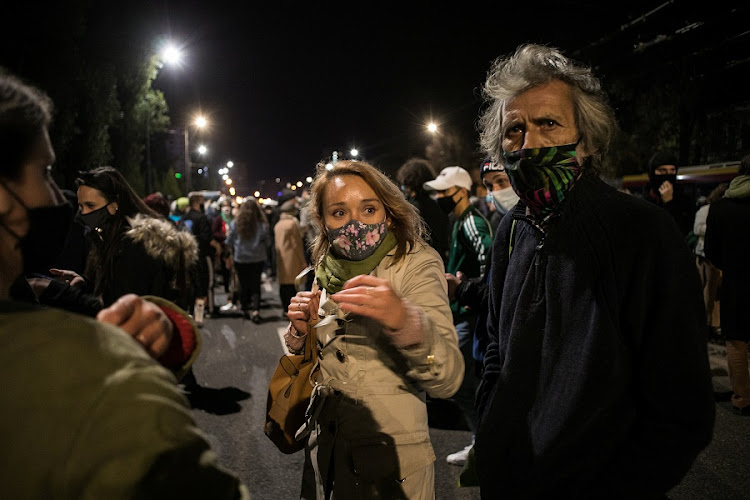 People gather near the house of Law and Justice leader Jaroslaw Kaczynski during a protest against imposing further restrictions on abortion law in Warsaw, Poland October 23, 2020.