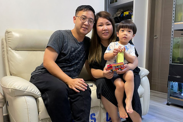 Eyebrow salon owner and a mother Lin Chan, 33, poses with her husband Wilson Man and son One Man, during the coronavirus disease (COVID-19) pandemic, in Hong Kong,