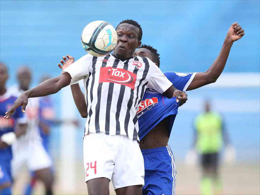 Maurice Odipo of Ushuru FC shields against Titus Echesa of Posta Rangers during the GOTv quater finals played at the Nyayo Stadium on 17 September. /PIC-CENTRE