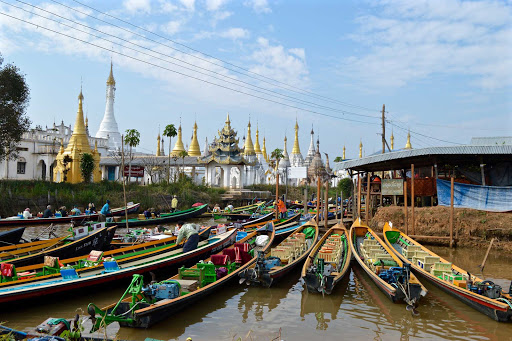 myanmar-fisherman-boats.jpg - Ellen Miller on Myanmar: "Every day we spent around Inle Lake, we would hop into a flat-bottom wooden boat with a guide and a driver and cruise along the lake for 5-7 hours, in and out of communities, floating gardens, taking in fisherman, pagodas, etc."