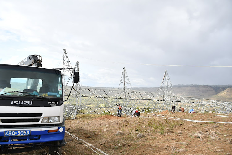 Staff from Kenya Power Company and Kenya Electricity Transmission Company move in (on 22-12-21) to repair one of the four electricity towers along that 220kv Loyangalani-Suswa line that clashed in Longonot area of Naivasha cutting off electricity power supply to the national grid. The move has resulted in an electricity generation shortfall which could see some regions in the country suffer from power outages.