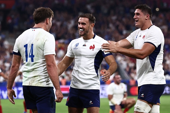 France's full-back Melvyn Jaminet (L) celebrates with flanker Paul Boudehent (R) right wing Damian Penaud after scoring a try during the 2023 Rugby World Cup Pool A match against New Zealand at Stade de France in Saint-Denis, on the outskirts of Paris on September 8, 2023.