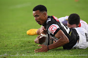 Curwin Gertse of the Sharks on the offensive but prevented from scoring a try by Vincent Tshituka of the Lions in the Currie Cup match at Ellis Park on February 19 2022.