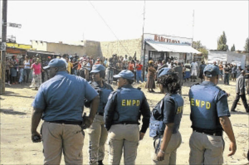 POLICE PRESENCE: Kwa-Thema residents took to the streets in protest after a contractor left site before completing a toilet project. PHOTO: SIBUSISO MSIBI