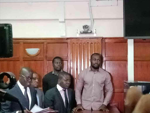 Rugby players Alex Mahaga and Frank Wanyama at a Milimani court where they were charged with gang rape, April 23, 2018. /STAR REPORTER