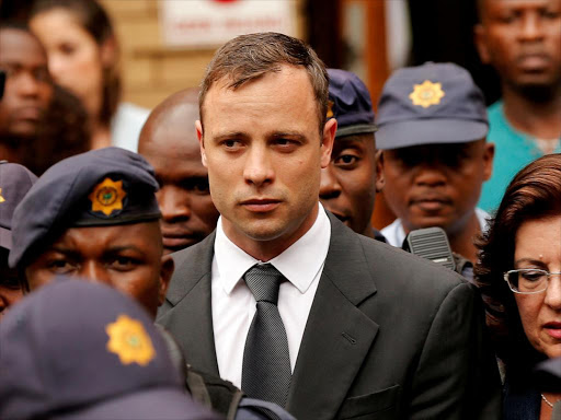 South African Olympic and Paralympic sprinter Oscar Pistorius leaves the North Gauteng High Court in Pretoria, South Africa, October 15, 2014.