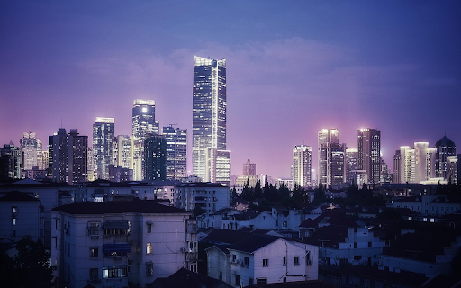 Glowing Skyscrapers Against Purple Twilight Sky screenshot 1