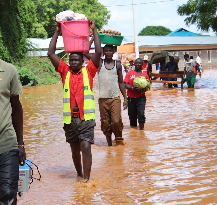 Flood victims in Sala walk last November