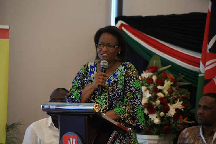 Health PS Susan Mochache addressing the audience during the the official opening of a dialogue on The Triple Threat at English Point Marina hotel in Mombasa on Thursday