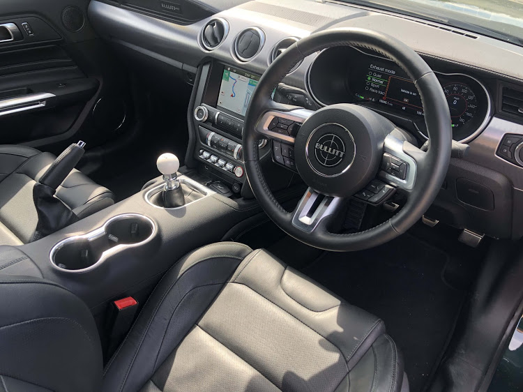 The interior gets some unique touches including a white cue ball gear lever.