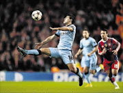 POISED: Manchester City striker Sergio Aguero controls the ball during their Uefa Champions League match against  
      
       Bayern Munich on Tuesday   
      Photo:  Laurence Griffiths/Bongarts/Getty Images