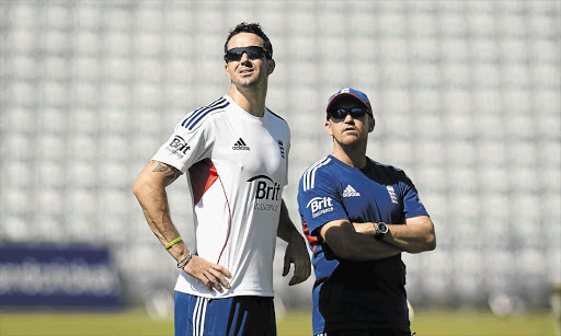 THE LONG AND SHORT OF IT: England's Kevin Pietersen with coach Andy Flower, right. The South African-born player's poor performances and lack of discipline of late could see him being forced out of the England set-up, as Flower reportedly does not see him as part of the team's future Picture: