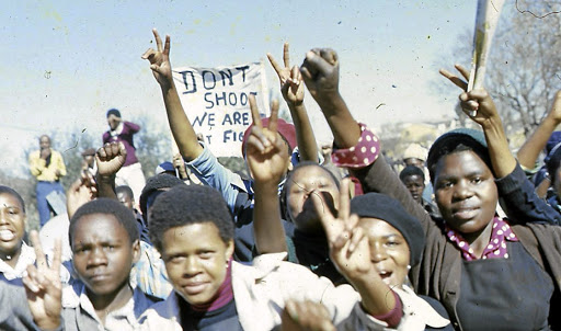 Youth protesting on the streets of Soweto. The writer says the youth are still fighting the struggle of their predecessors and have not started fighting their own struggles.