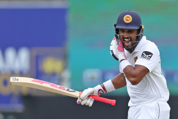 Dinesh Chandimal celebrates after posting 200. Picture: BUDDHIKA WEERASINGHE/GETTY IMAGES