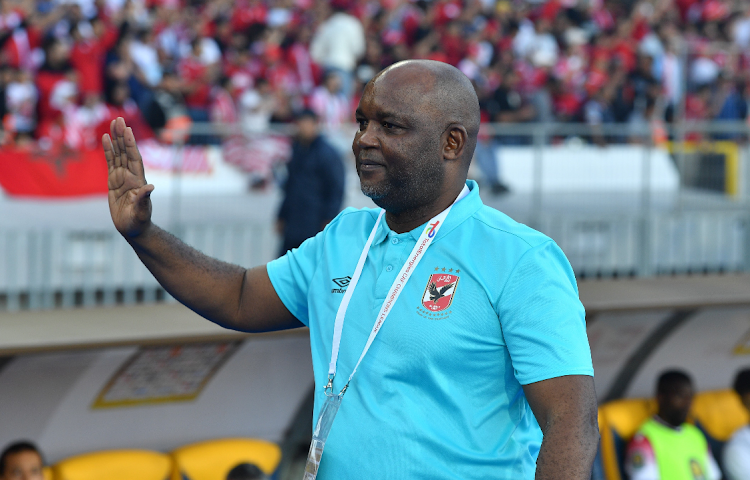 Al Ahly coach Pitso Mosimane gestures during the CAF Champions League final between Al Ahly and Wydad Athletic at the Mohammed V Stadium in Casablanca.