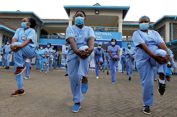 Nurses participate in a Zumba aerobic fitness program as a way of helping them to cope with working situations during the coronavirus disease (COVID-19) outbreak within the Infectious Disease Unit grounds of the Kenyatta National Hospital in Nairobi, Kenya May 28 2020.