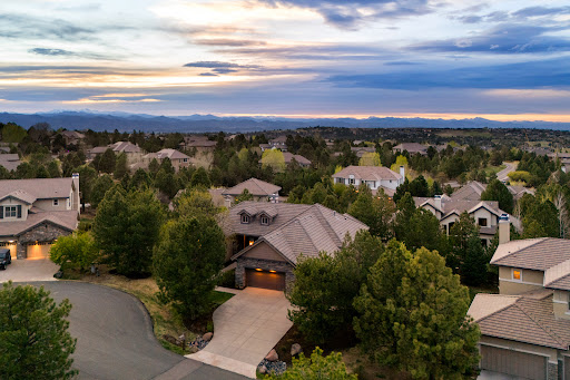 Residential neighborhood with houses and trees in this luxury property for sale in Castle Rock ($2,400,000)