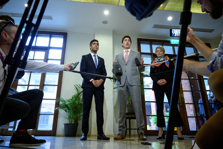 British Prime Minister Rishi Sunak, left, and Prime Minister Justin Trudeau of Canada hold a news conference at the G20 summit on November 16 2022 in Nusa Dua, Indonesia. Picture: POOL via REUTERS/LEON NEAL