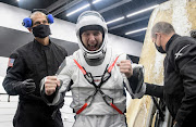 Nasa astronaut Mike Hopkins is helped out of the SpaceX Crew Dragon Resilience spacecraft recovery ship after he, Nasa astronauts Shannon Walker, Victor Glover and Japan Aerospace Exploration Agency (JAXA) astronaut Soichi Noguchi landed in the Gulf of Mexico off the coast of Panama City, Florida, US, on May 2 2021. 