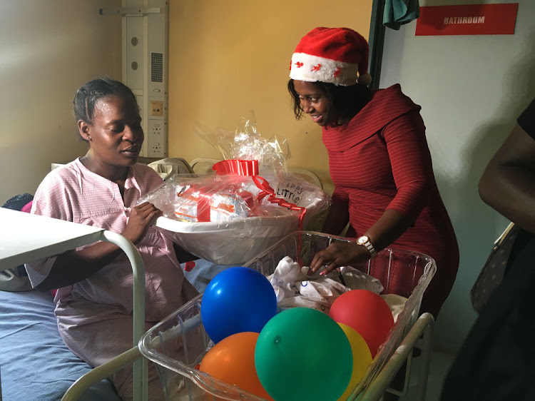 Health MEC in Mpumalanga showering new babies born on Christmas Day with gifts.