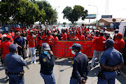 EFF supporters outside the Dobsonville police station in Soweto to support Victor Ramerafe who opened a case of assault, intimidation and housebreaking against Operation Dudula leader Nhlanhla Lux Dlamini. File photo.