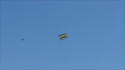 Flying banner to advertise a strip club!!!