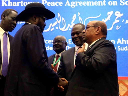 South Sudan President Salva Kiir, Sudan's Omar al Bashir and South Sudan rebel leader Riek Machar talk after signing a peace agreement in Khartoum, Sudan, June 27, 2018. /REUTERS