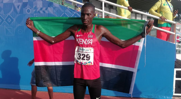 Titus Ekiru celebrates after winning the 21km race in Rabat