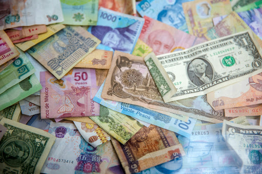 Euro surges on Ukraine ceasefire proposal, tariffs squeeze stocks