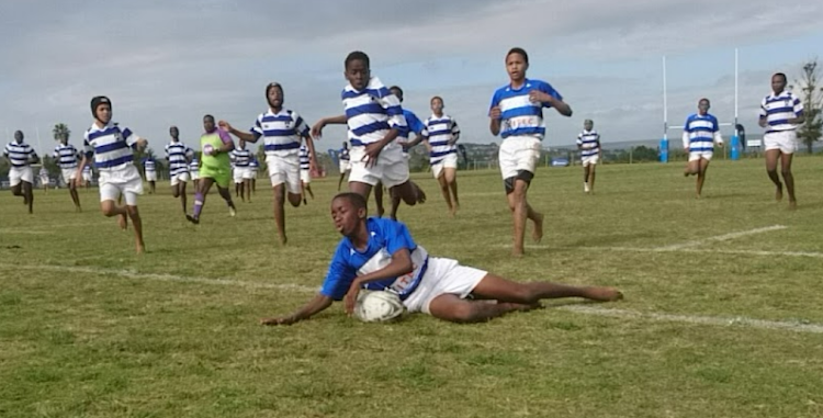 Gonubie U13A fullback Cwenga Nomnganga crosses the line to score his second try of the match against Westering on Monday