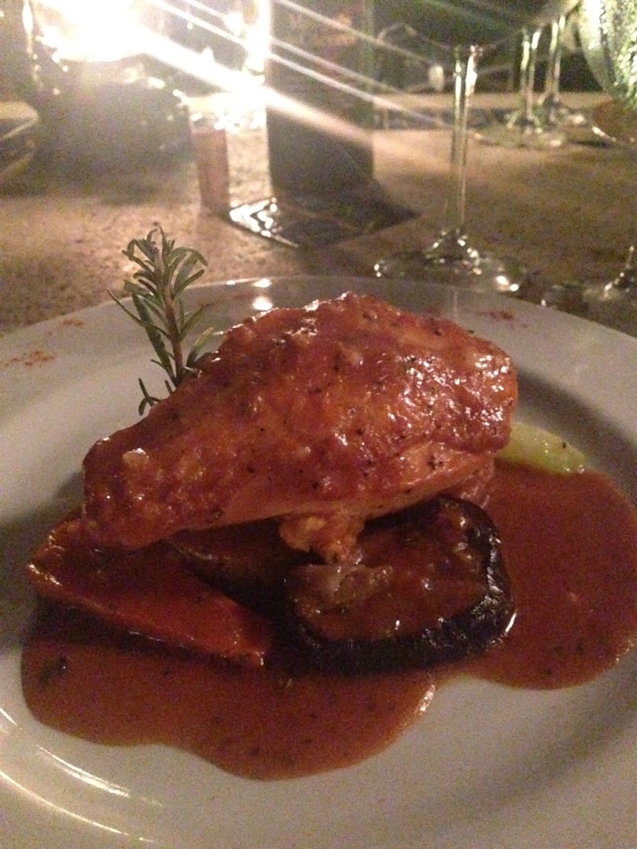 Sweet potato and cheddar stuffed, oven roasted chicken with s Cabernet Sauvignon Demi glaze.