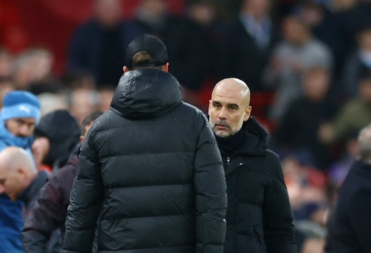 Manchester City manager Pep Guardiola with Liverpool manager Juergen Klopp after the match. Picture: CARL RECCINE