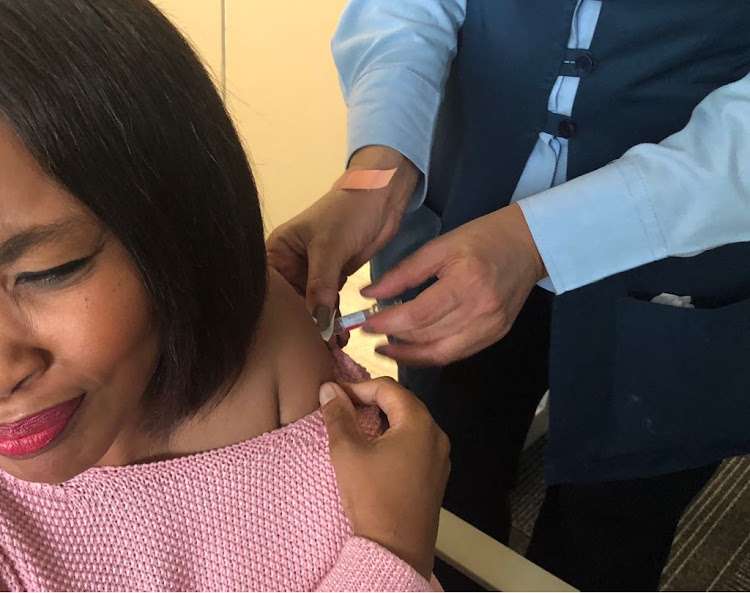 Nandile Yani gets her flu shot in Cape Town.