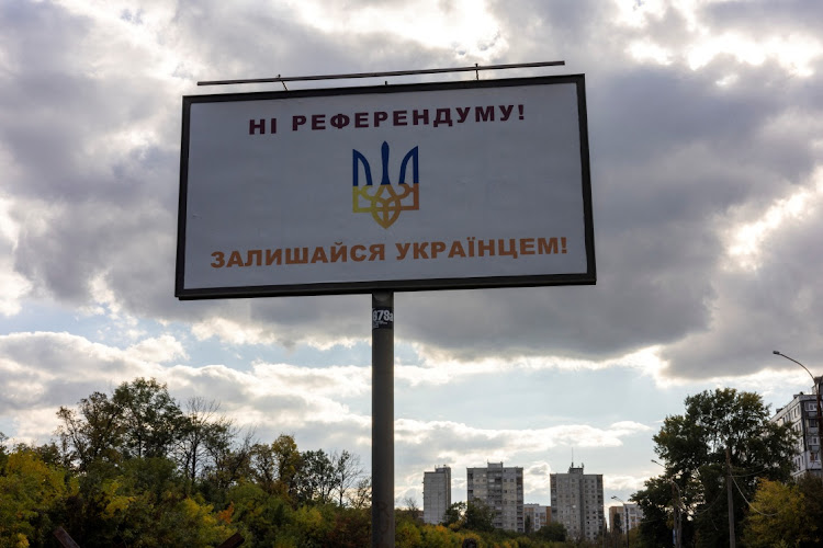 A billboard reads "No to the referendum! Stay Ukrainian!" on a main road in Kharkiv, days before referendums on joining Russia take place in several largely Russian-held regions in eastern and southern Ukraine from September 23 2022. Picture: REUTERS/UMIT BEKTAS