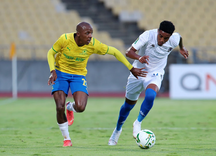 Khuliso Mudau of Mamelodi Sundowns is challenged by Gerald Phiri Jr of Al in the Caf Champions League group match at Royal Bafokeng Stadium in Rustenburg on the February 11 2022.