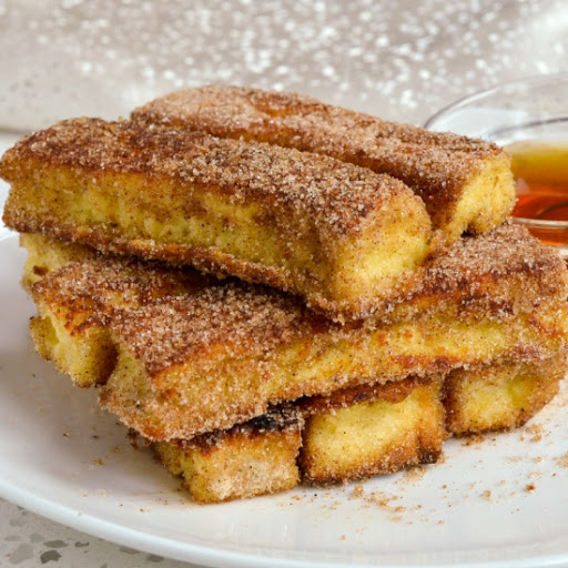 These delectable French Toasts Sticks are pan fried to perfection and rolled in cinnamon sugar.  They come together quickly and easily using many ingredients that you may already have on hand.