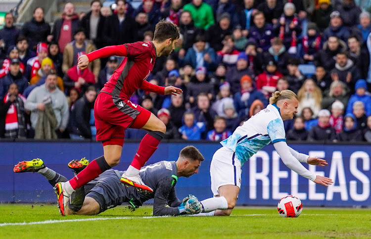 Norway's Erling Braut Haaland (R) in action with Armenia's Styopa Mkrtchyan and David Yurchenko