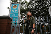 Kelly Fraser poses for a portrait outside an FNB branch in Randburg, Johannesburg. She is the young woman who formed the FNB heists victims' Whatsapp group and has co-ordinated all their efforts to get FNB to take some responsibility for the heists and their huge losses.