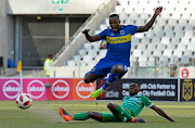 Ayanda Patosi of Cape Town City FC tackled by Lucky Baloyi of Bloemfontein Celtic during the Absa Premiership match at Cape Town Stadium in Cape Town on Saturday December 22 2018.
