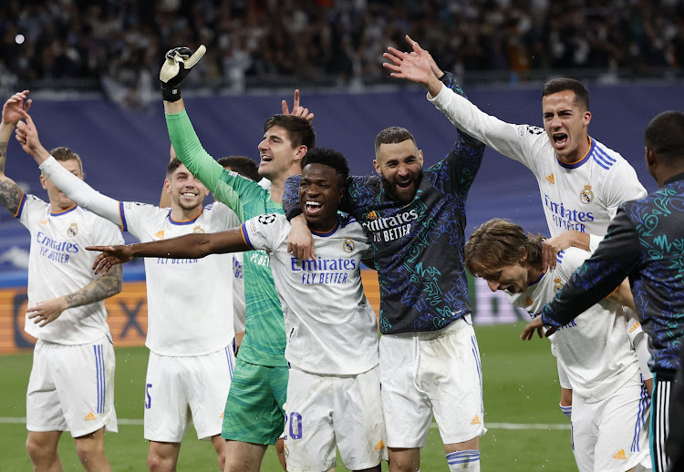 Real Madrid players celebrate after the match.