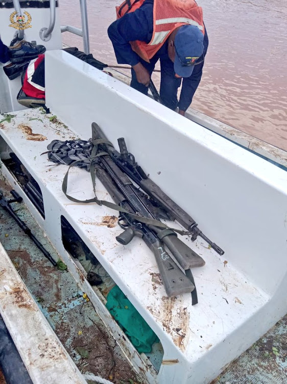 Firearms placed in a boat in an ongoing rescue mission.