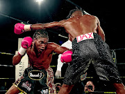 Thulani Mbenge, seen here taking on Eric Kapia Mukadi in a recent fight, stands a big chance to contest the Welterwight Super Four later this year. PHOTO: ANTON GEYSER/GALLO IMAGES