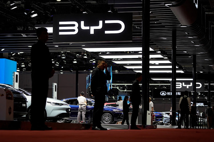 Security guards stand at the BYD booth at the Auto Shanghai show, in Shanghai, China, April 19 2023. Picture: ALY SONG/REUTERS