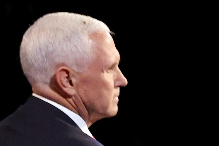 A fly briefly lands on head of US Vice President Mike Pence during a debate against Democratic vice-presidential nominee Senator Kamala Harris.