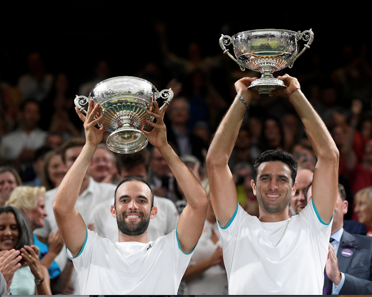 Colombia's Juan-Sebastian Cabal and Robert Farah celebrate winning the men's doubles in Wimbledon last year