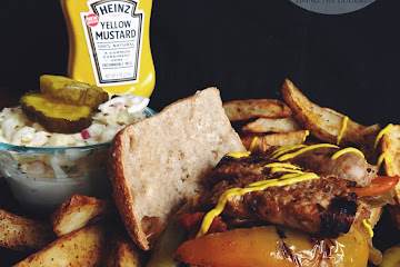 Sausage and Peppers Submarine with Steak Fries featuring Heinz Yellow Mustard®